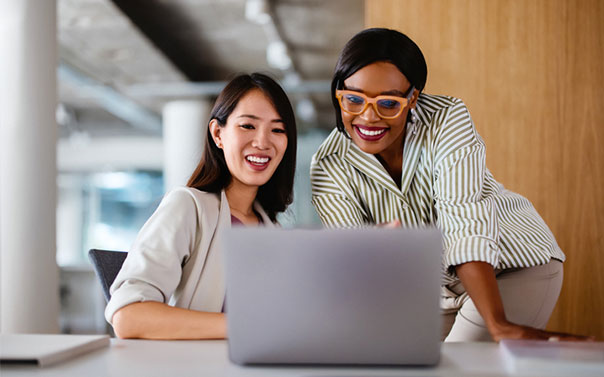 two female professionals collaborating on a project