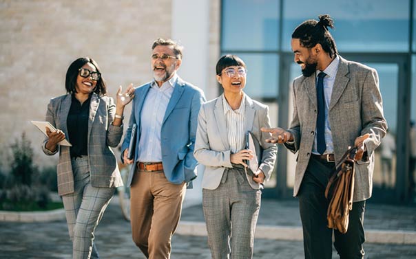 A team of directors reviewing a presentation